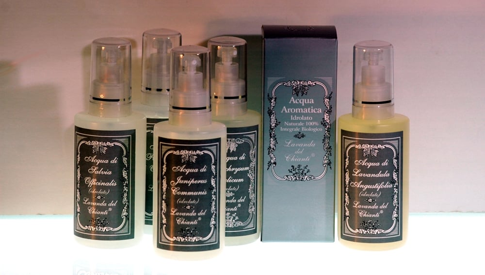 Bottled packaging with spray dispenser of organic lavender, sage and juniper floral waters with silver cardboard box and white writing: "Lavanda del Chianti"