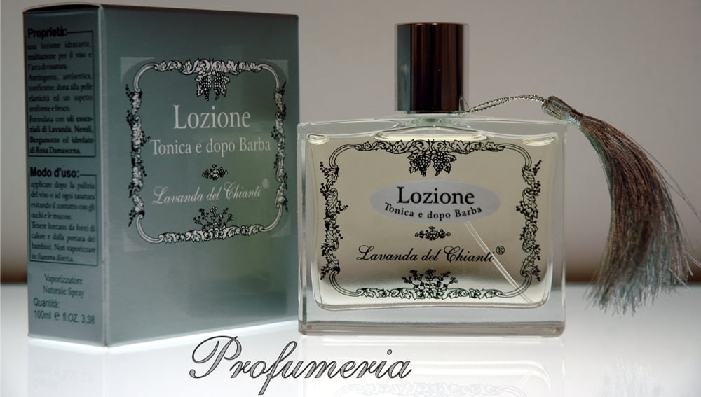 Perfume bottle in transparent glass with black screen-printed label and the inscription: "Lavanda del Chianti". Silver box with inscription: "Tonic and after shave lotion". Light luminous background and inscription: "Perfumery"