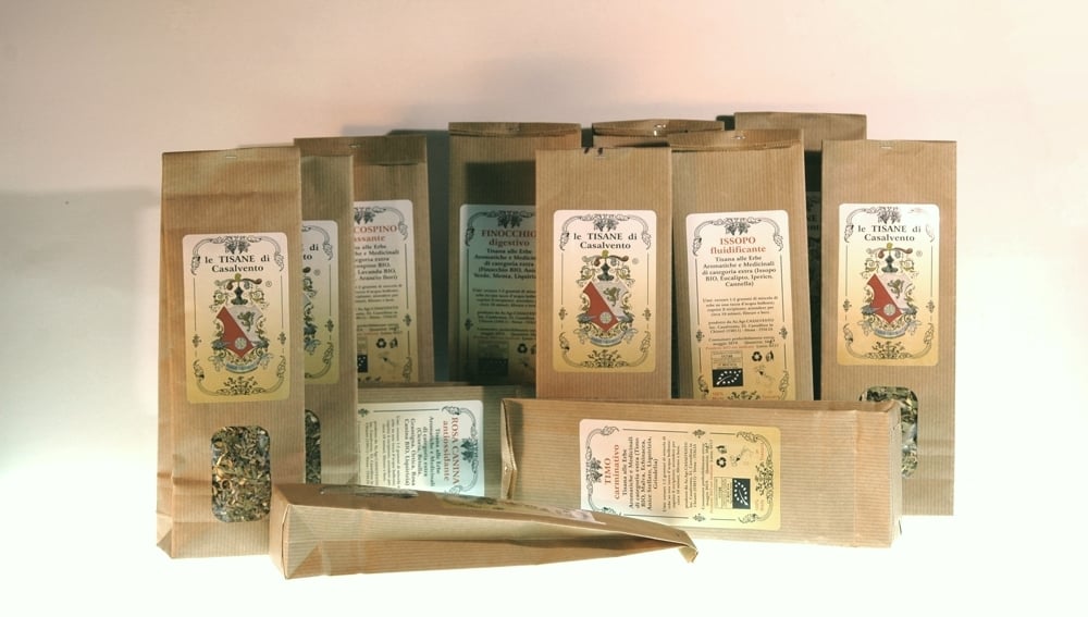 Series of paper herbal tea bags and label with the Casalvento coat of arms on a white background